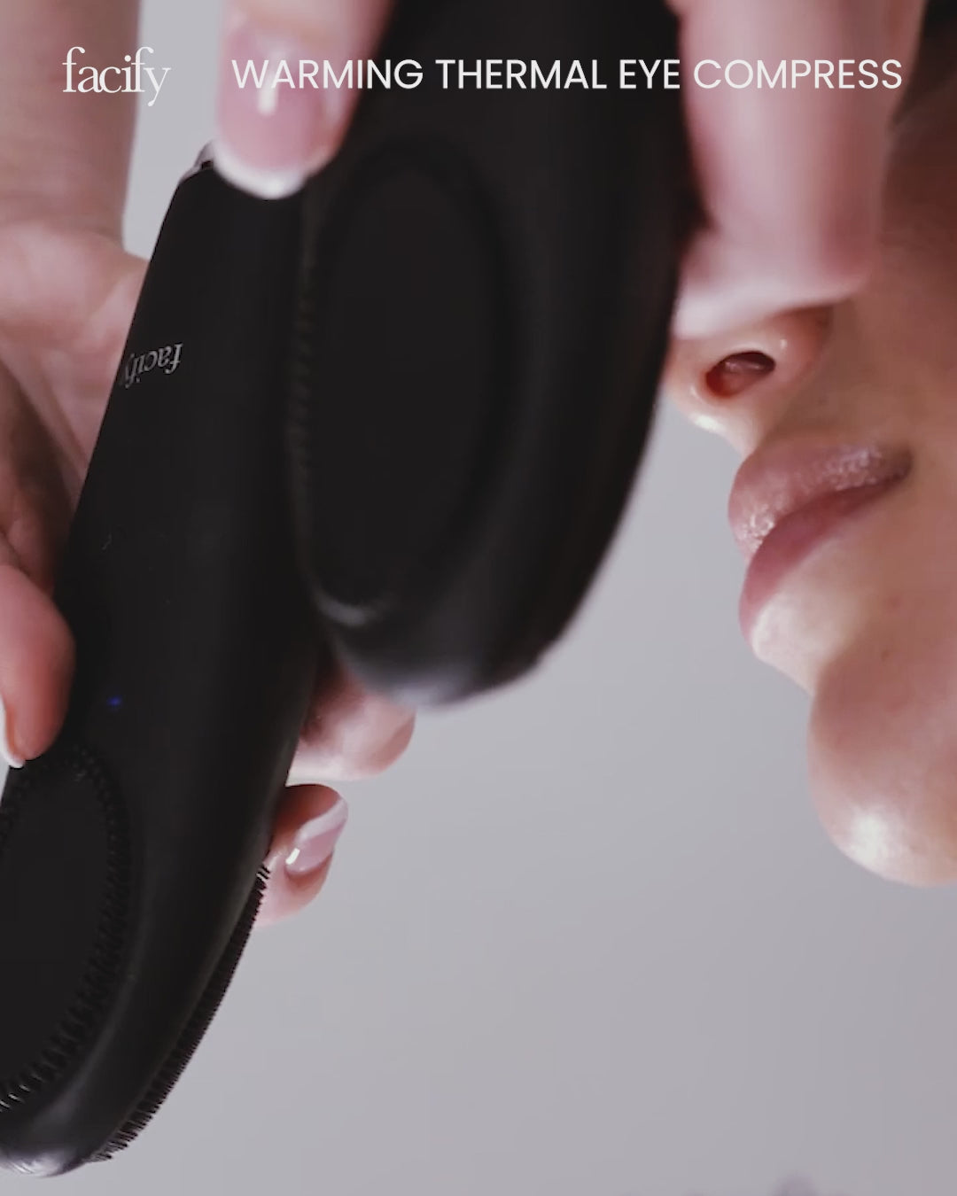 woman receiving a treatment using the eye compress attachment of the facify wand