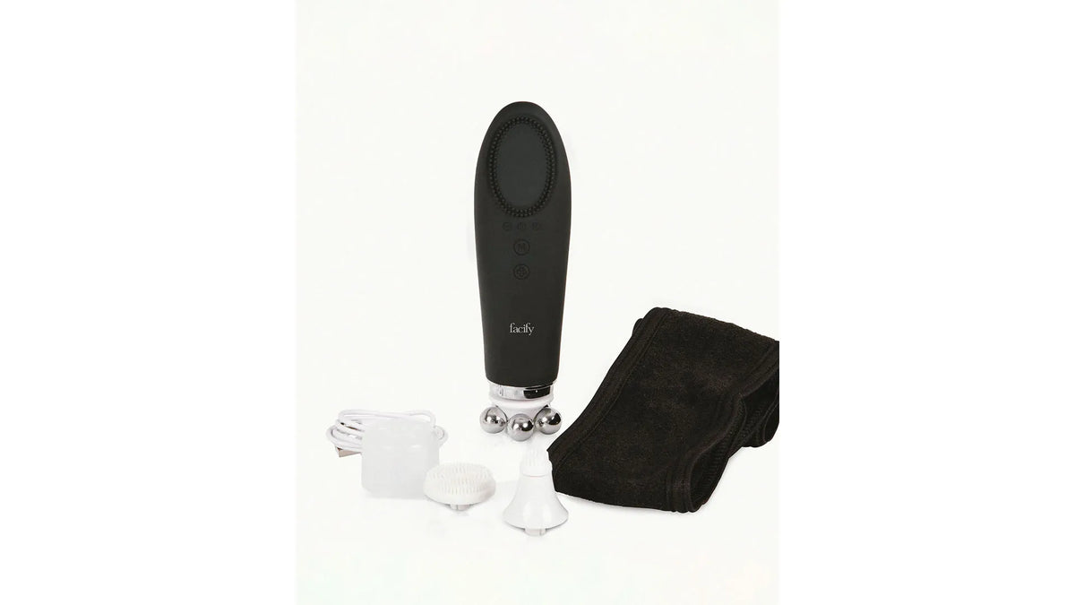 Facify Beauty Wand with its included cleansing heads, massage head, USB charger, and headband