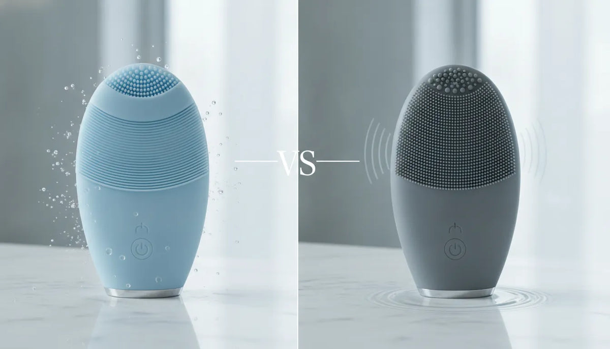 Rotating and sonic facial cleansing brushes on a marble surface.