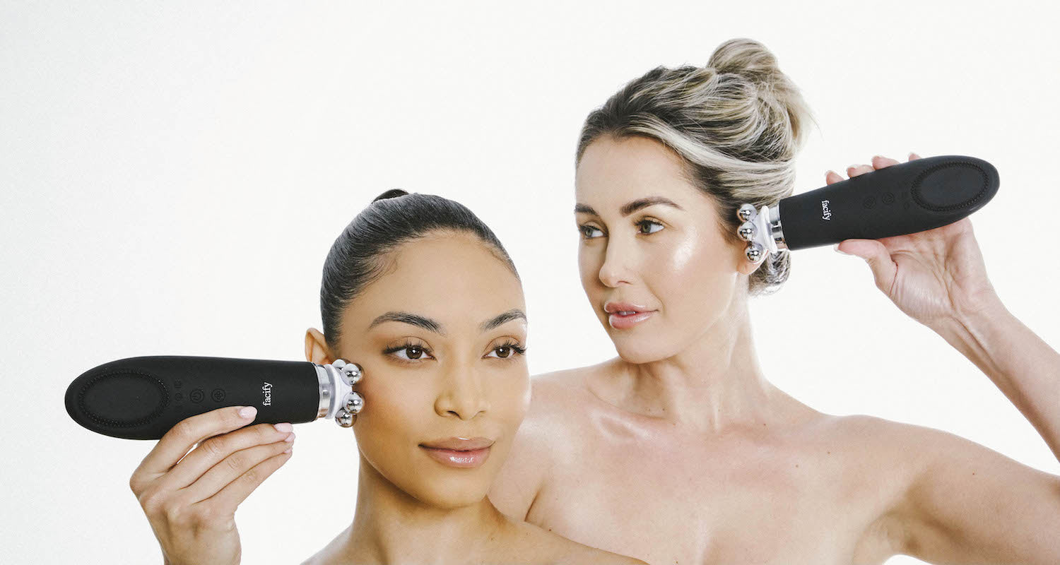 two women using the 5 iron head massager attachment on the facify beauty wand device on their face