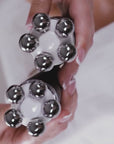 close up of the iron head massagers of the facify beauty wand rotating